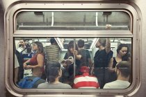 Street Photos of Commuters Reading on the Subway 