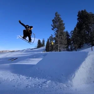 Snowskater Soaring Off the Booter