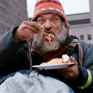 Homeless guy eating