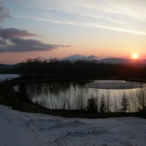 Sunrise over snowmaking pond
