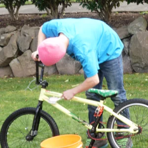 My kid washing his bike