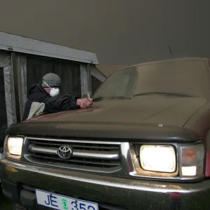 My dad cleaning the ash of our car