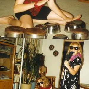 The kitchen band that my sister and I started when I was nine... Her mic. is a sock over a wooden sp