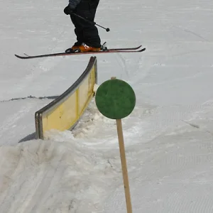 green slope and green rail