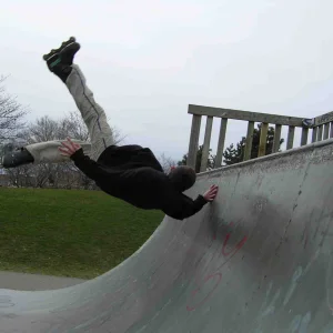 rollerblade in the half-pipe