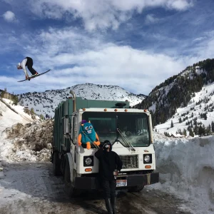 Driving truck above Rob's garbage truck