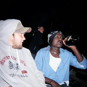 akin drinks brandy from the bottle