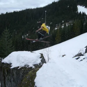 Half spin onto rock jib