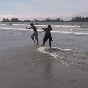 Skimboarding while being pulled.