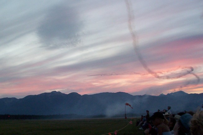2 Planes Flying Into A Sunset