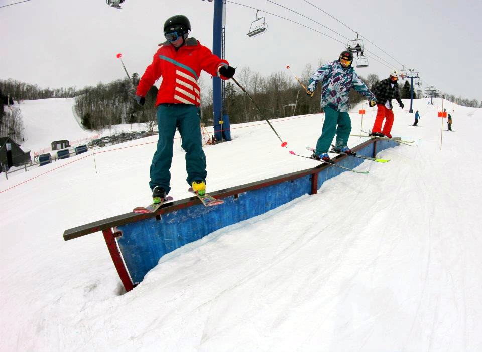 3 Skiers One Rail