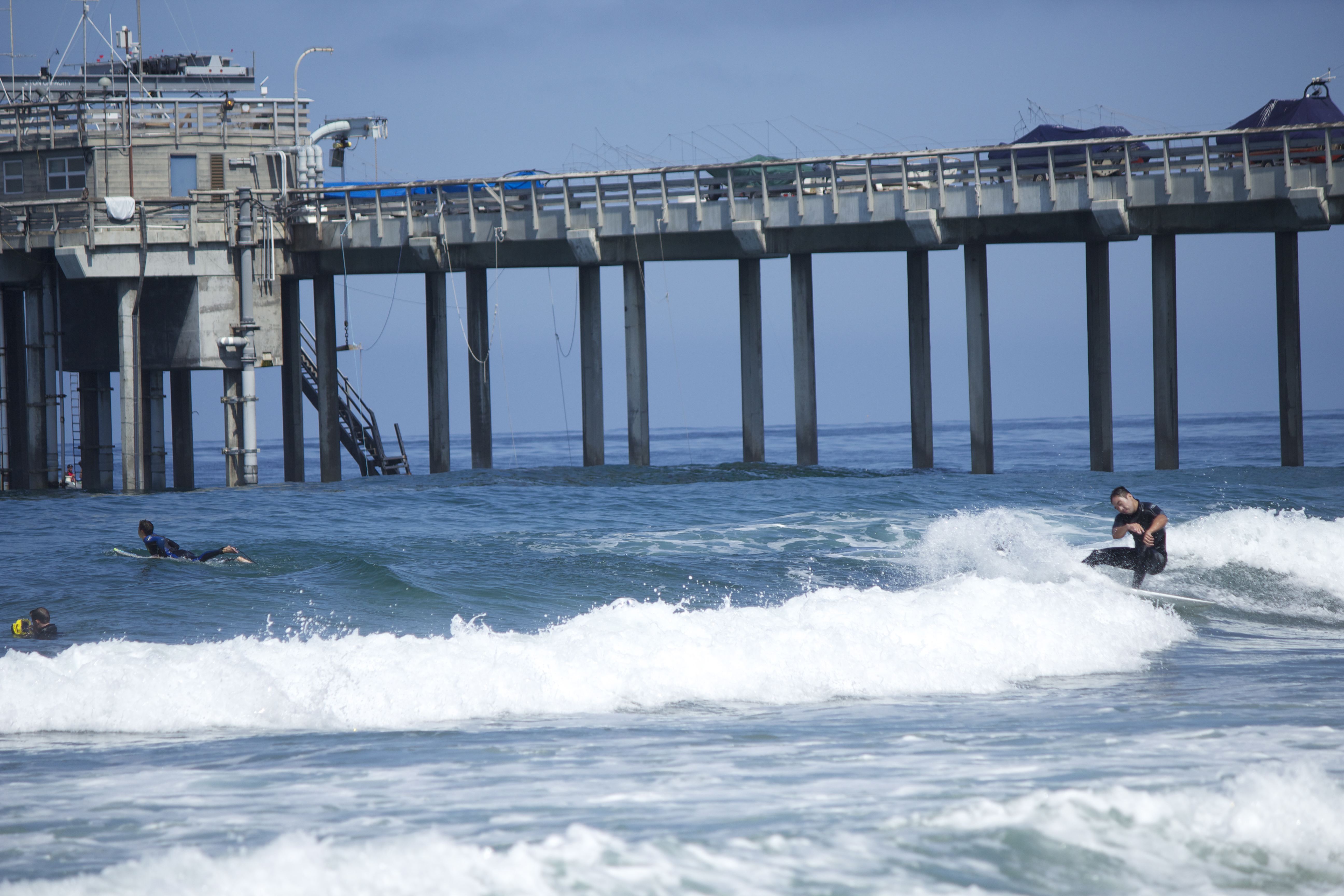 A Surfer and a Pier