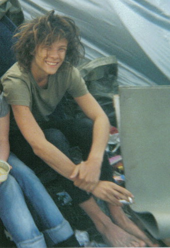 Alex at a music festival. looks like a bum
