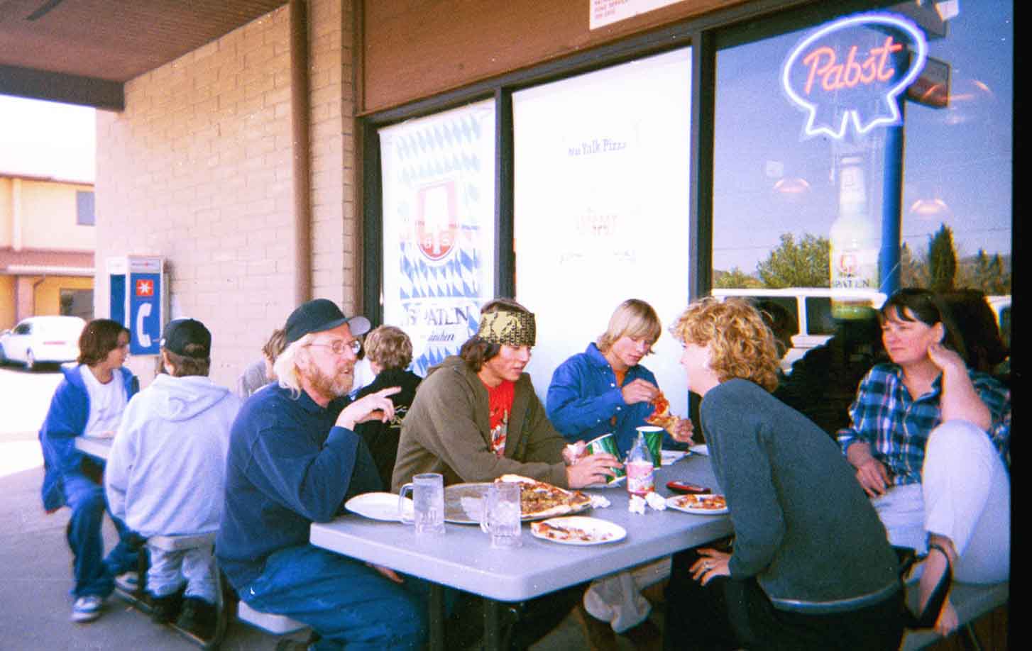 At the pizza joint with everyone , were in the back