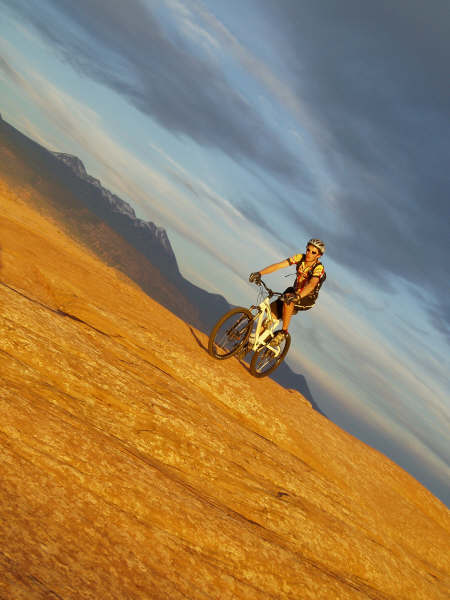 Biking slickrock at sunset