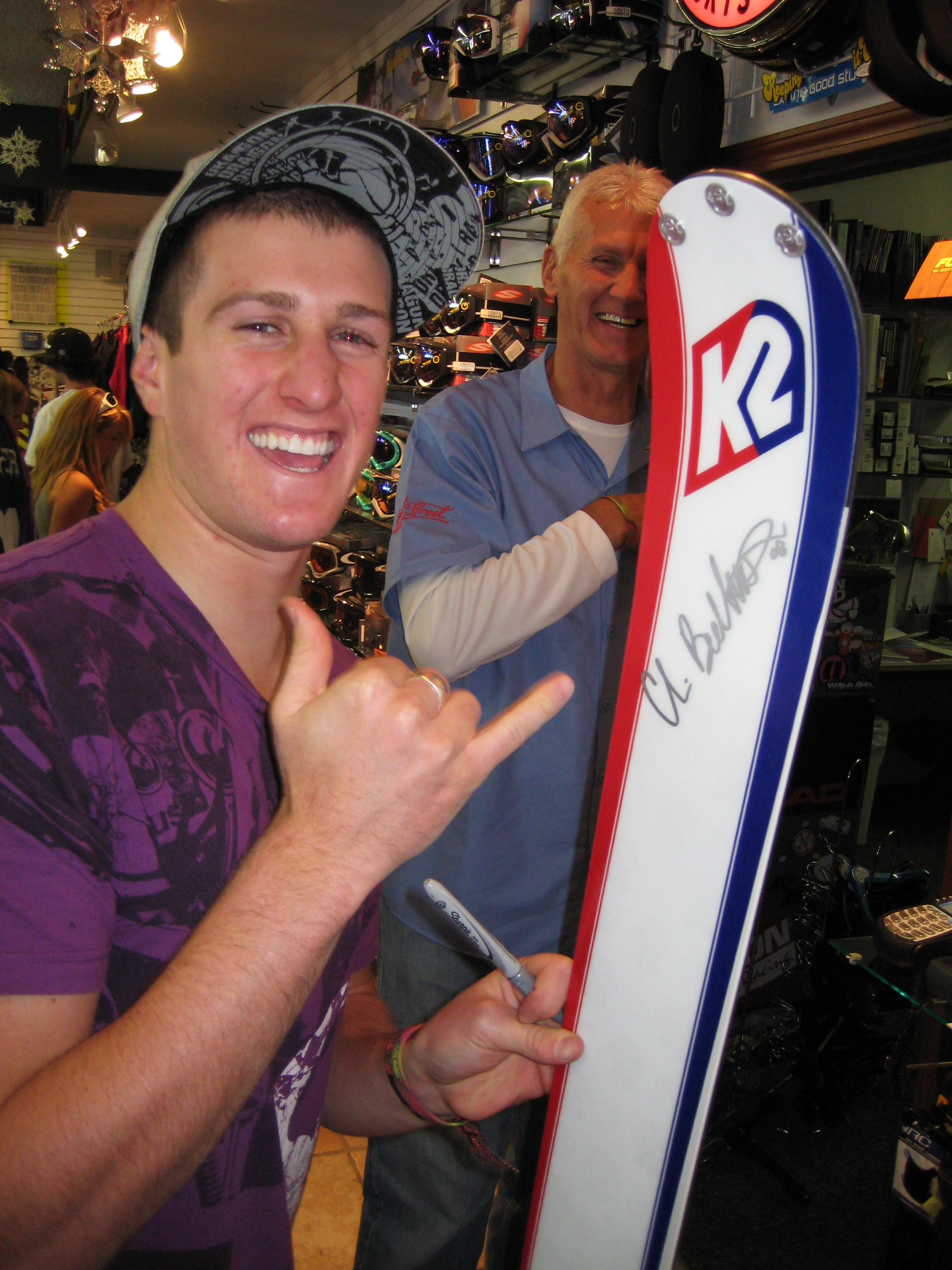 Chris gives autographs and free shakas.