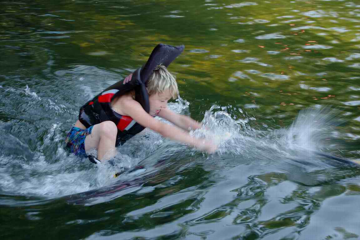 Connor trying to get up on his wakeboard