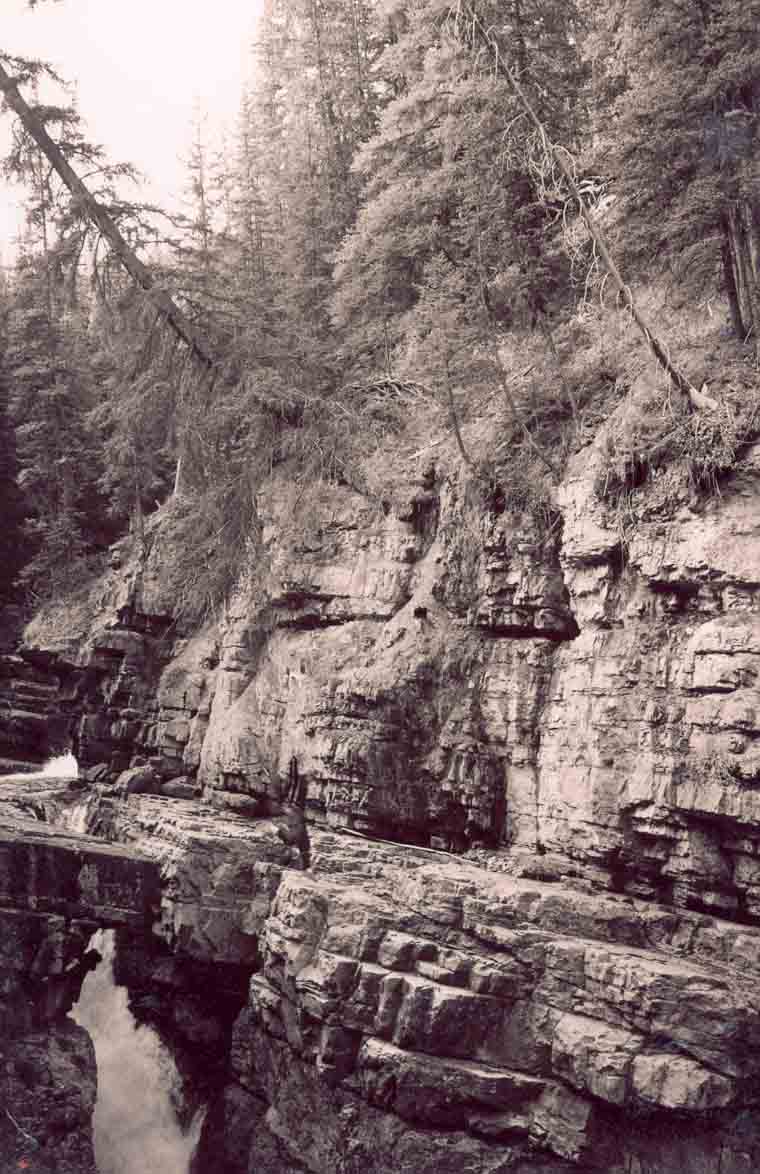 CRazy Gap Jump Over a Death Fall. See Rapelling off a waterfall to see drop.