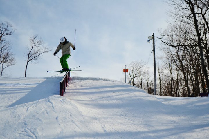 Crossed skis on the rail