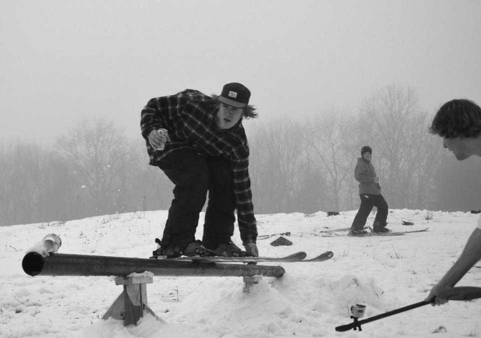 Drinking a beer and touching my ski while on a grindbar