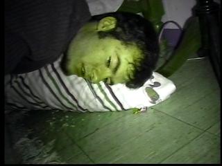 Drunk as fuck and puking on my floor.