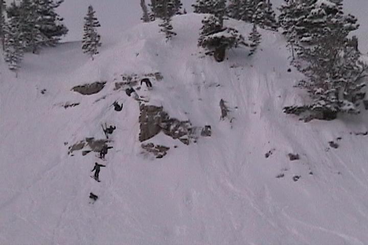 Eric doing a front flip over last chance cliffs at Alta