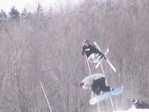going huge over a snowboarder with a mute