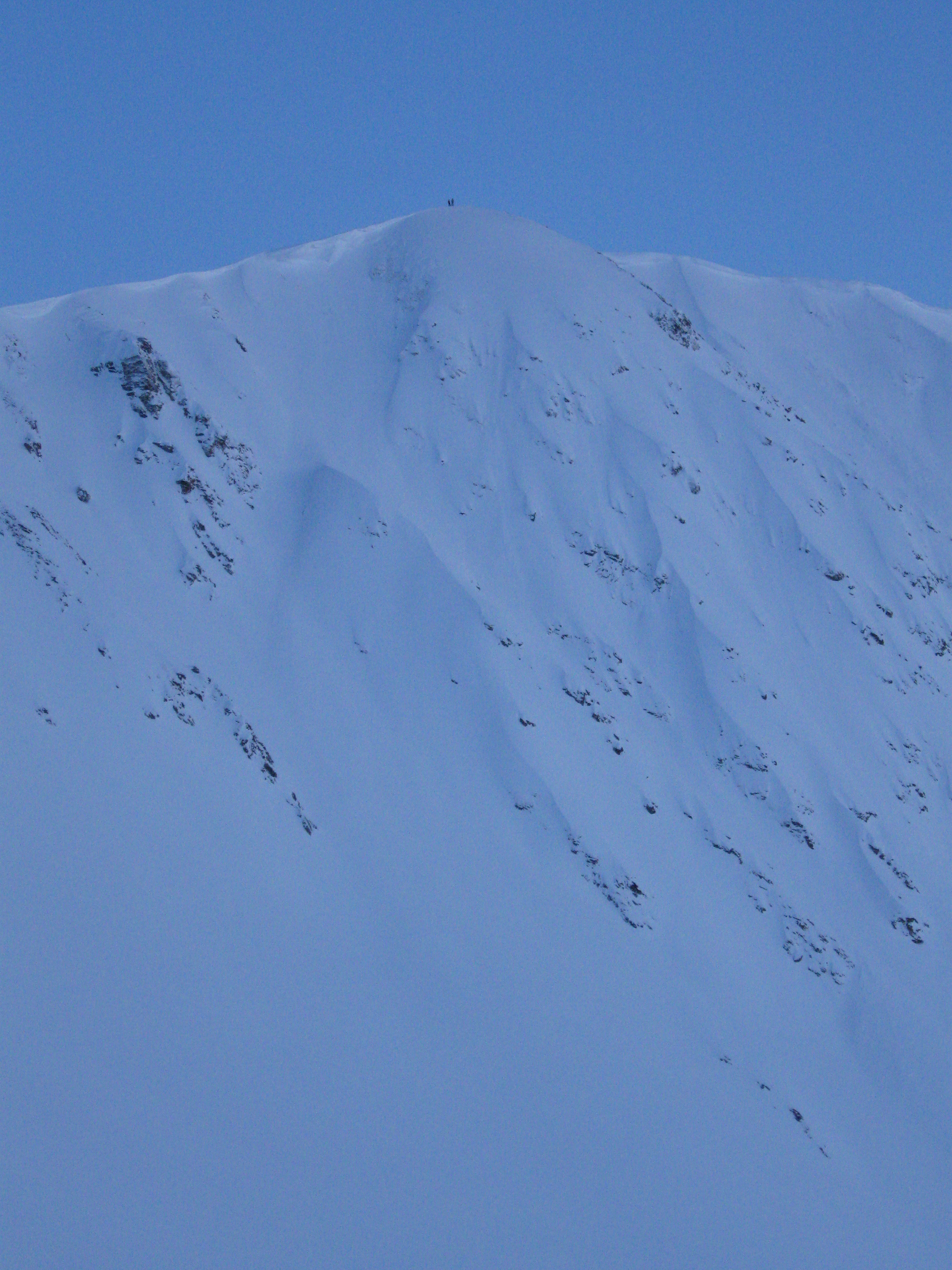 Gold pan with skiers @ summit