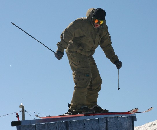 Greasing the down outside Le Massif lodge