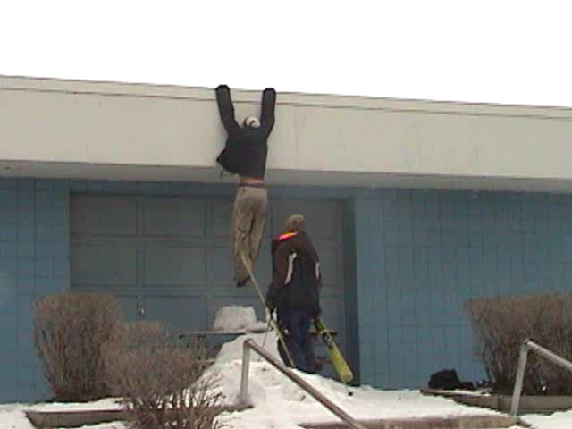 Hanging from swimming pool building