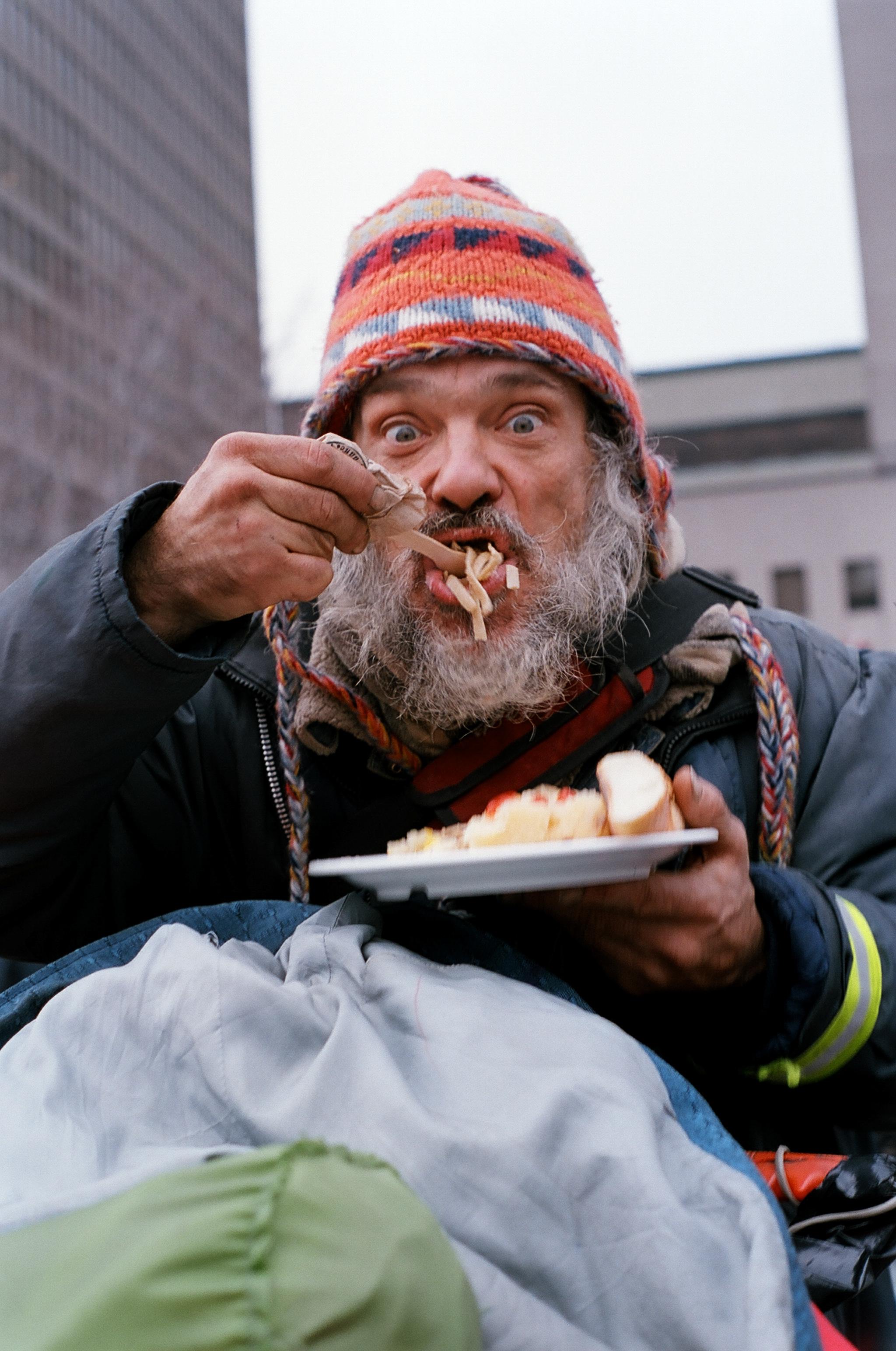 Homeless guy eating