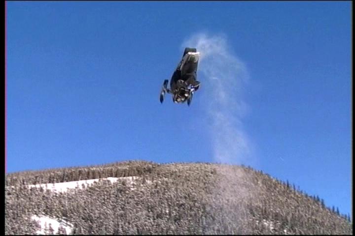 jay quinlan doin a backflip on his snowmobile