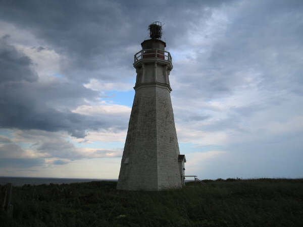 kinda cool shot abandoned lighthouse with storm rolling in