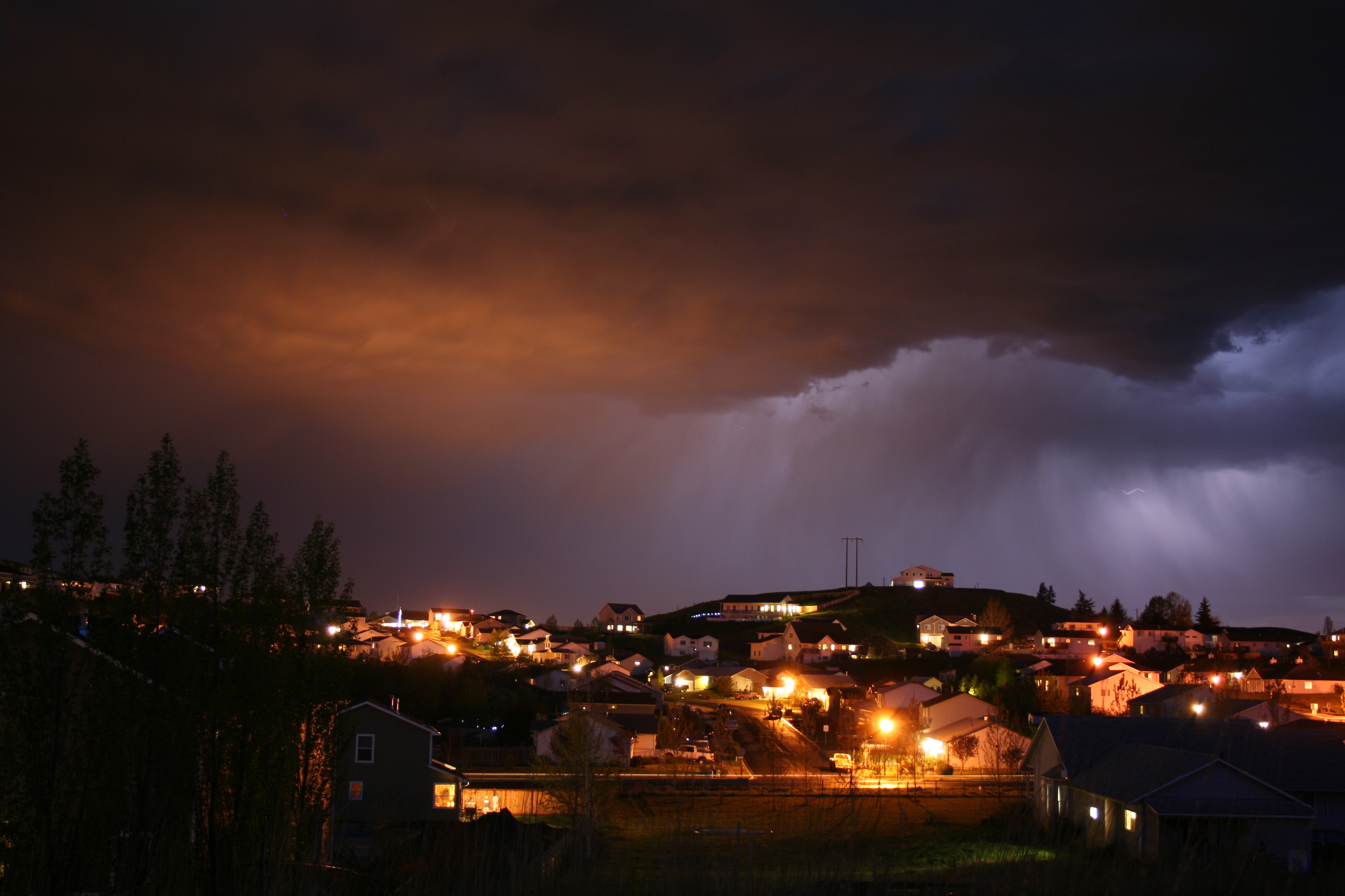 Lightning behind clouds