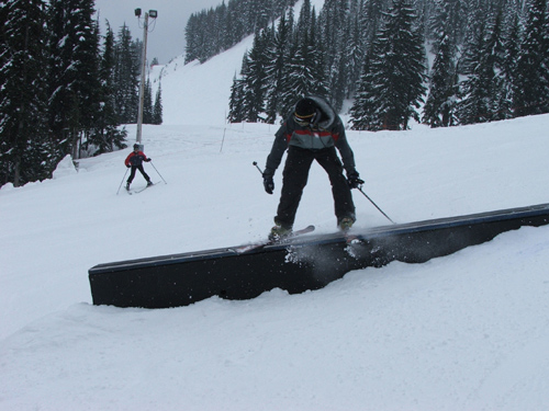 making some turns through the snowboard park