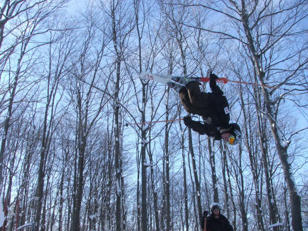 me doin a backflip off a jump at our air site
