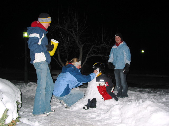 me n the girls making a snowman