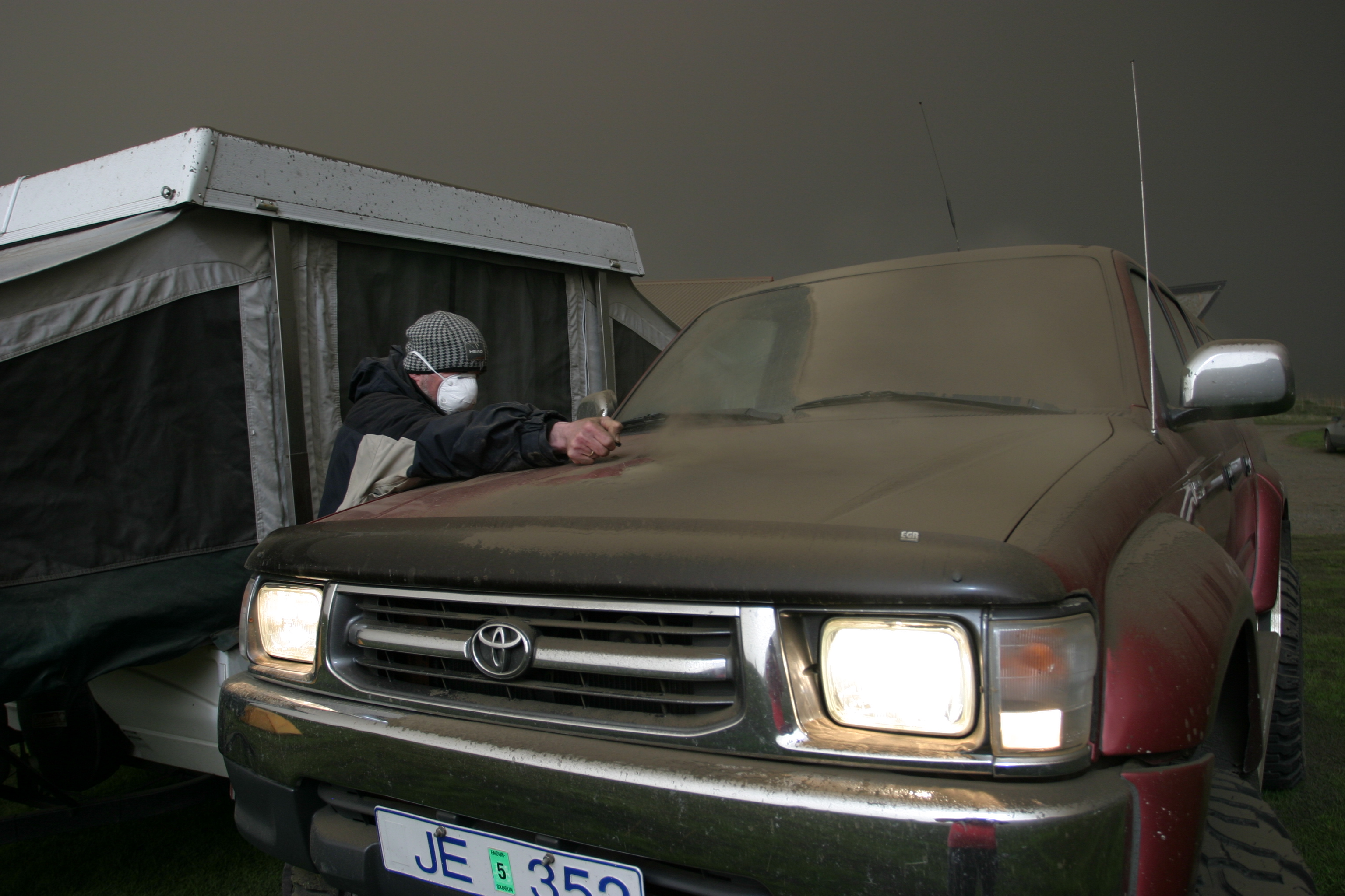 My dad cleaning the ash of our car