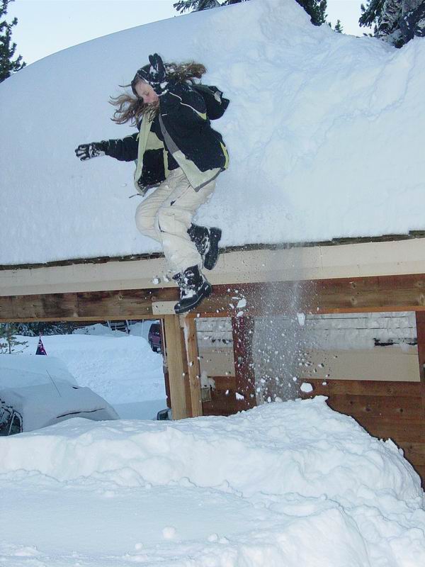 My sis thinkin she's hard core by jumpin off of our roof into like 5 feet of pow.