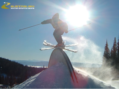 nice rainbow with sum sunlight in the backround