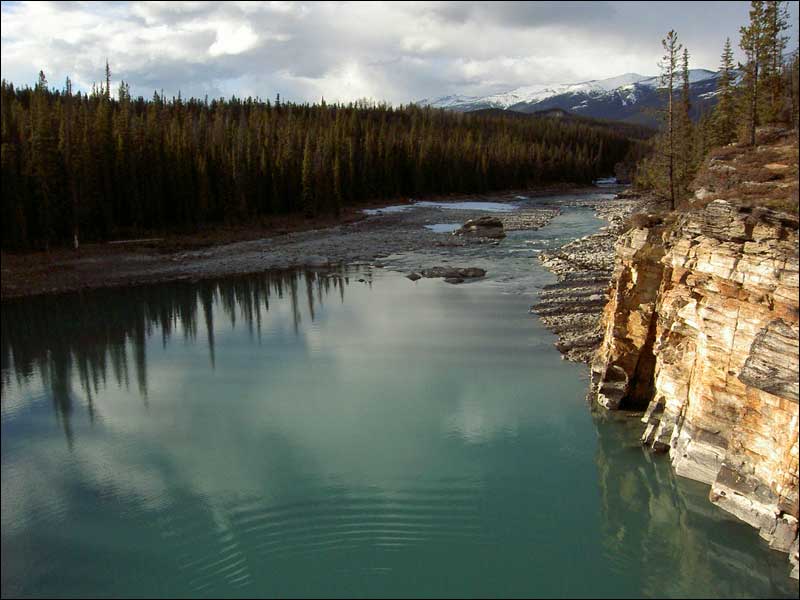 Out West- Atop a cliff and into the river