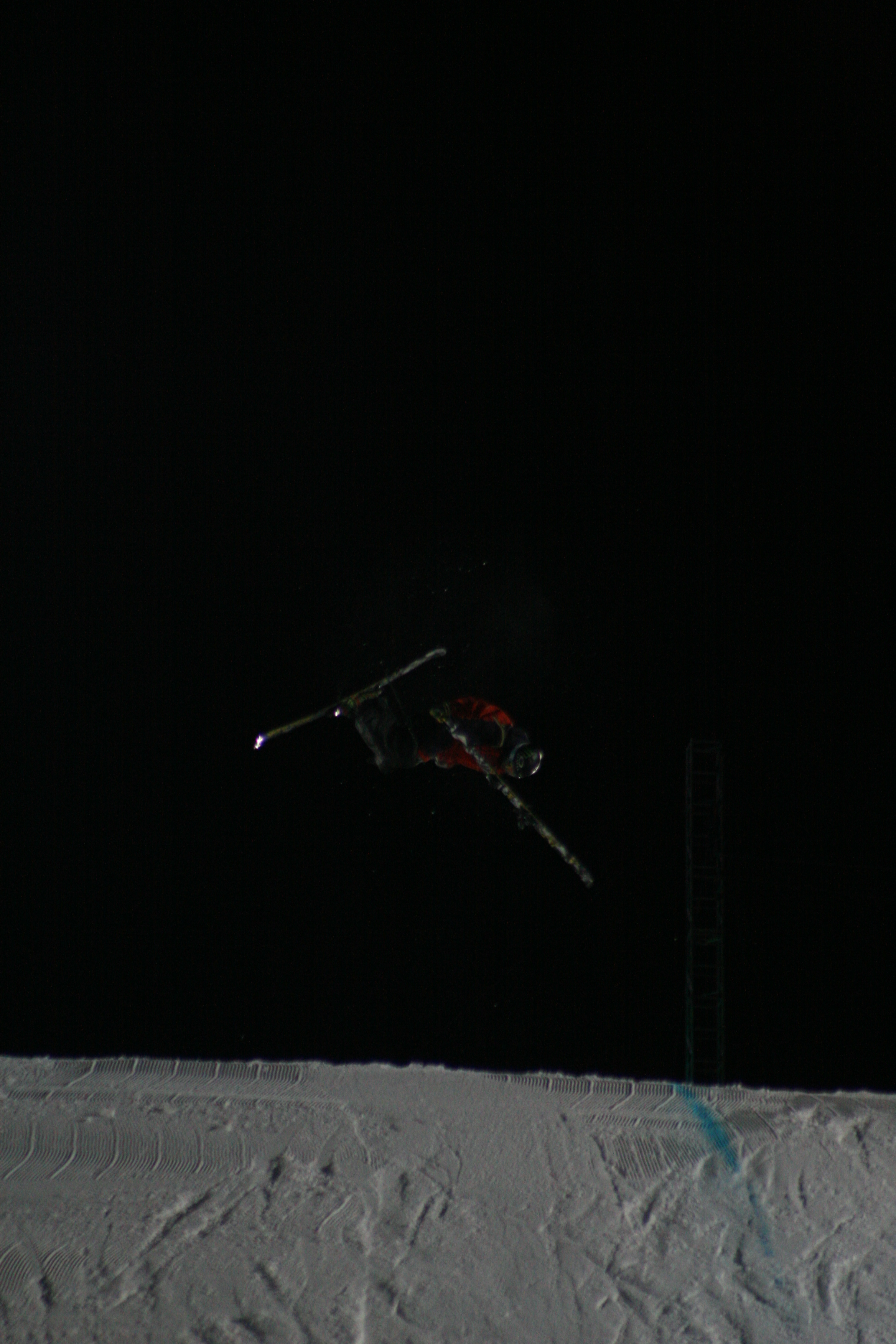 Pulling off ski mid-air.
