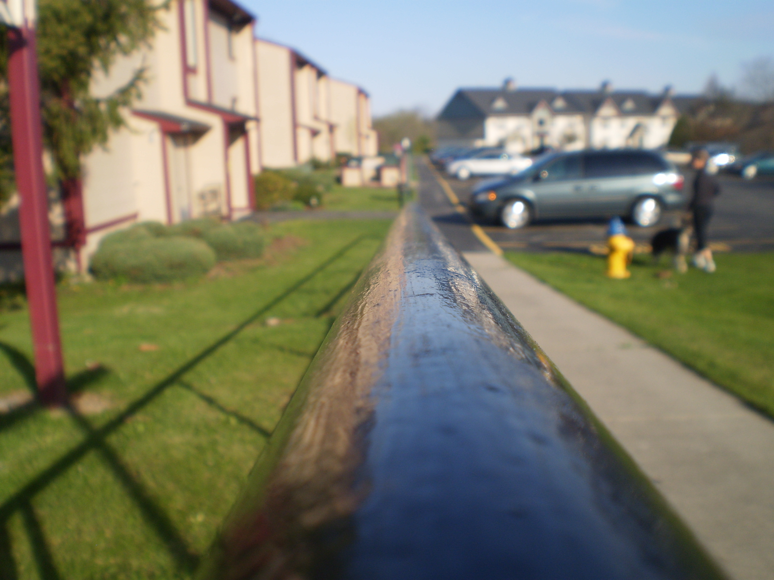 Rail next to the road by the apartments