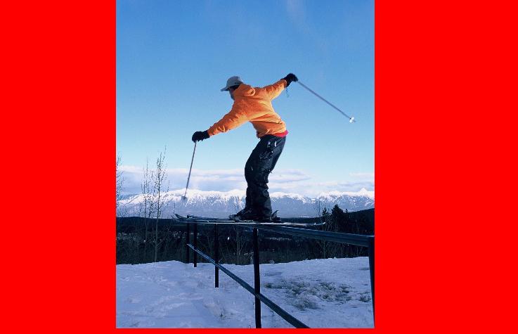 RAIL WIT ROCKIES IN BACKGROUND