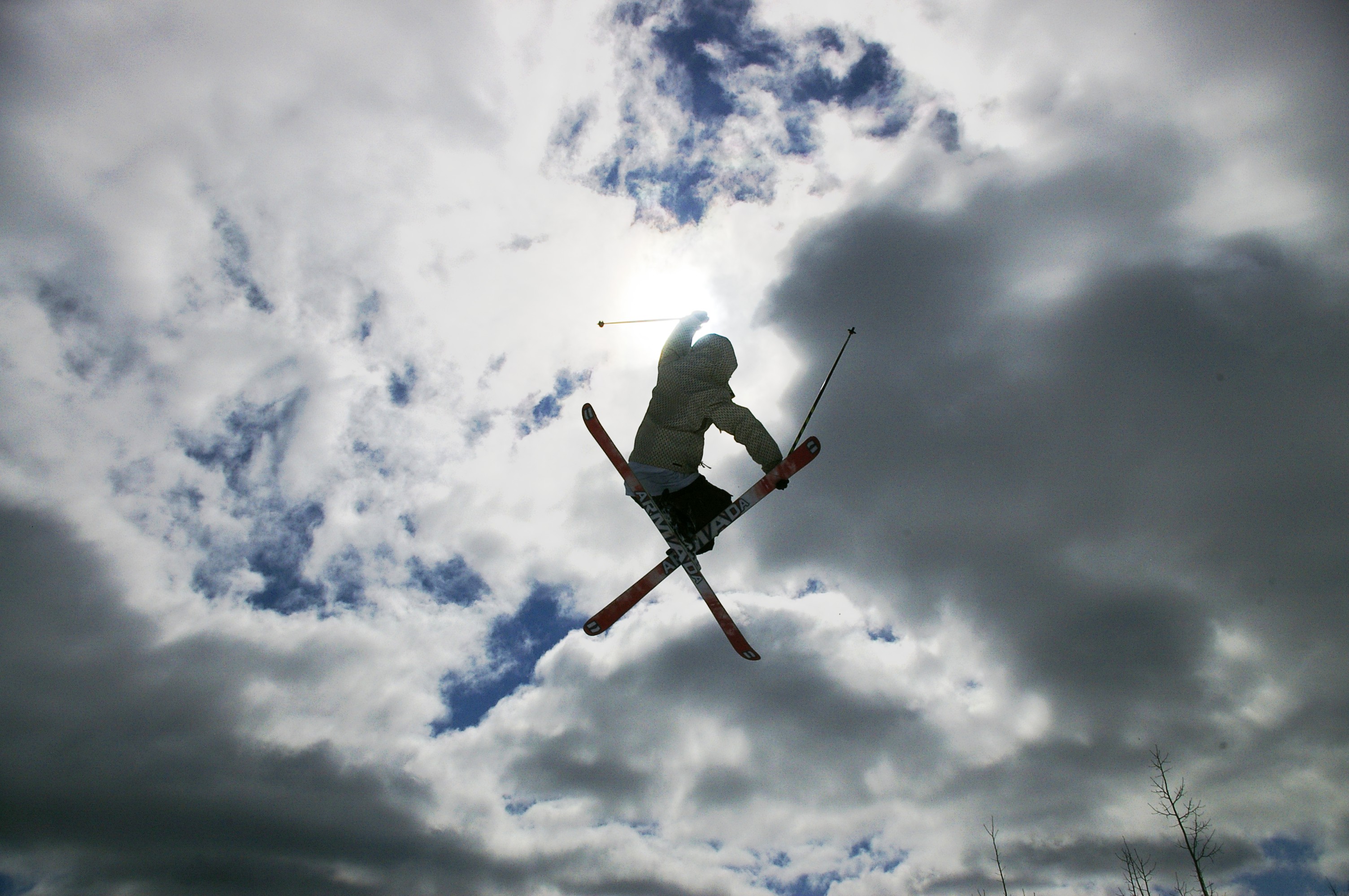 Raising his hand to the sun..