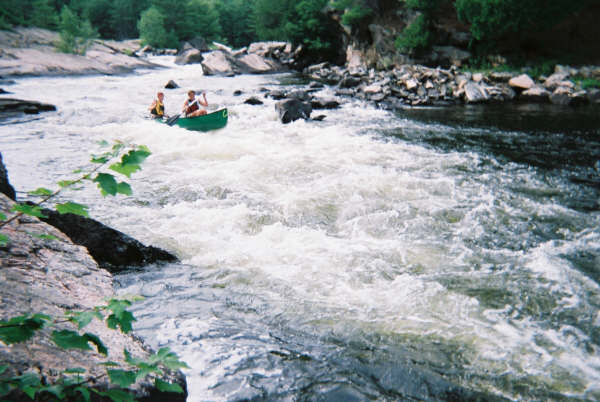 Running some heavy class III in an open canoe...fun.