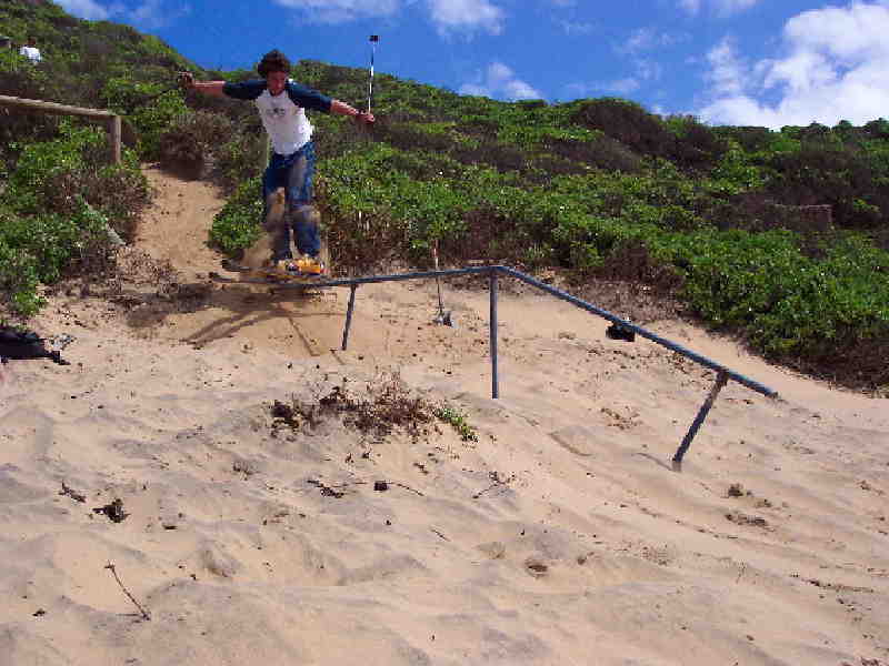 Sand skiing to flat down rail