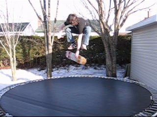 skateboard on trampoline (varial-kick indy)