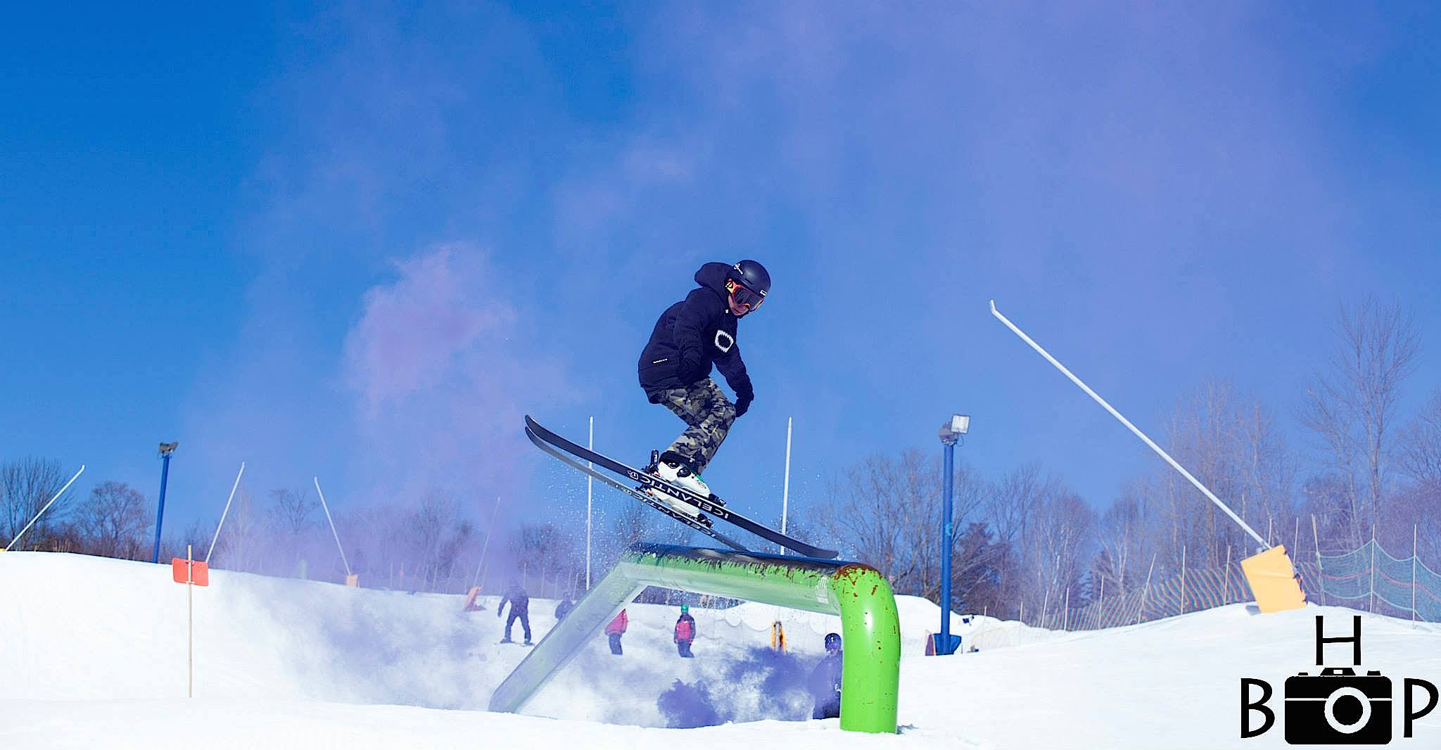 skiing on rail