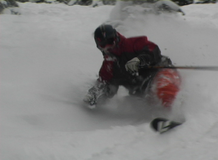 skiing powder without his heels connected